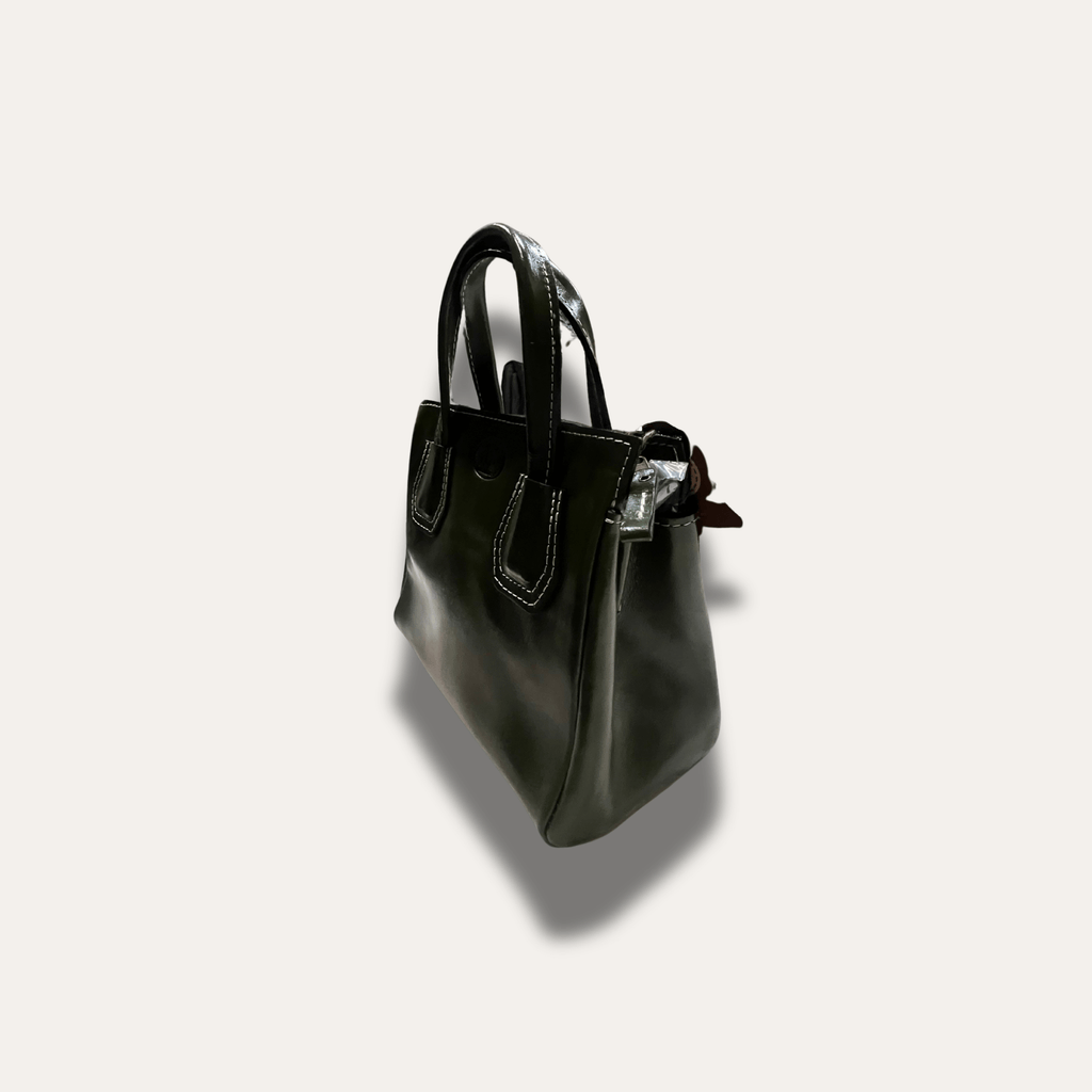 Dimitra Black leather handbag, handcrafted since 1918, showcasing elegant design and premium craftsmanship.