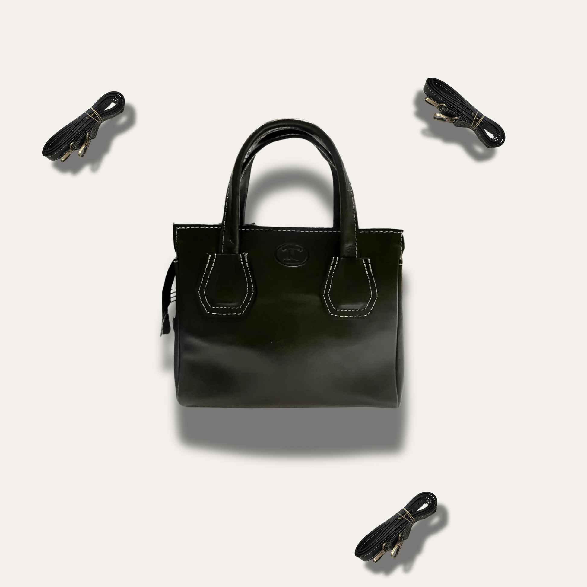 Dimitra Black leather handbag, handcrafted since 1918, featuring elegant design and additional straps for versatility.
