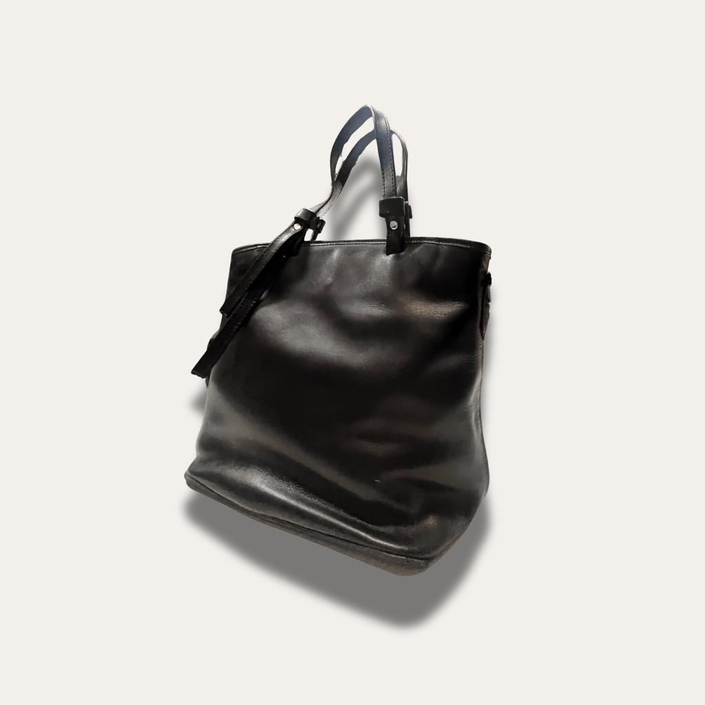 Kalliopi Black leather handbag, handcrafted since 1918, showcasing a sleek design and durable quality.