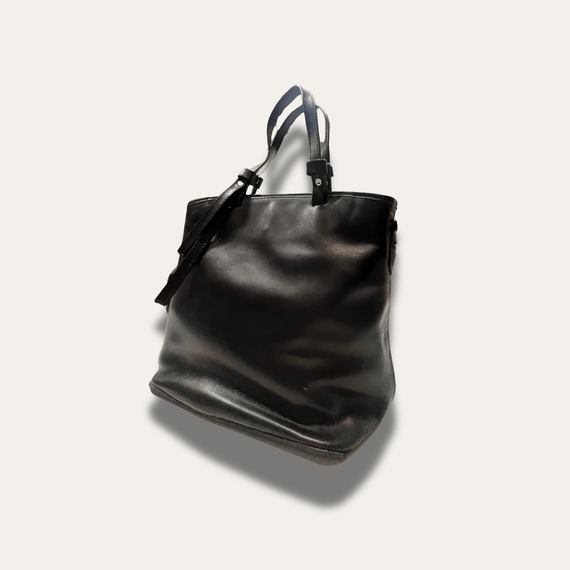 Kalliopi Black leather handbag, handcrafted since 1918, showcasing a sleek design and durable quality.