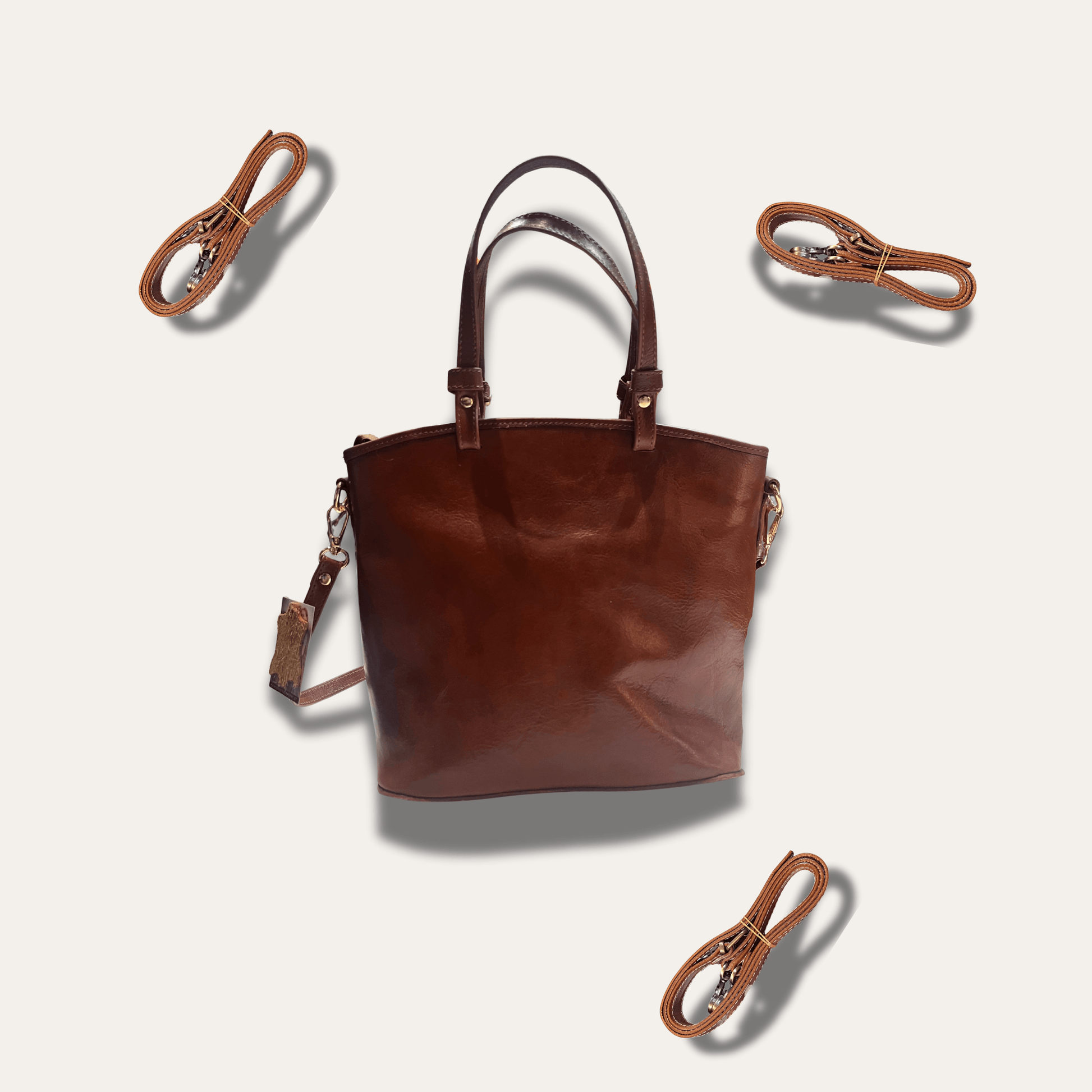 Anna Brown leather handbag, handcrafted since 1918, stylish and durable with detachable straps.