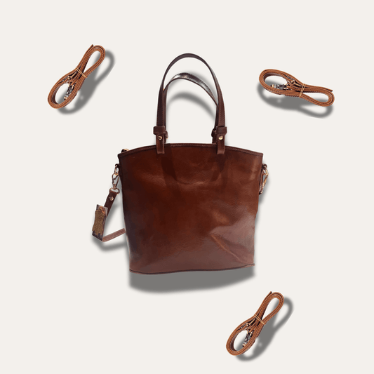 Anna Brown leather handbag, handcrafted since 1918, stylish and durable with detachable straps.